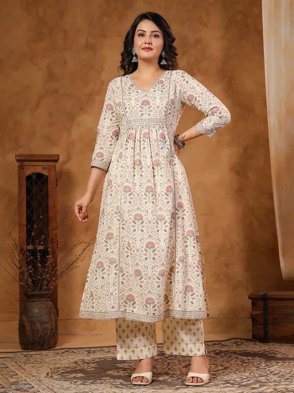 Cream silk kurti set with coin and aabla work