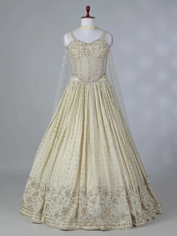 Cream silk lehenga choli with beaded detailing