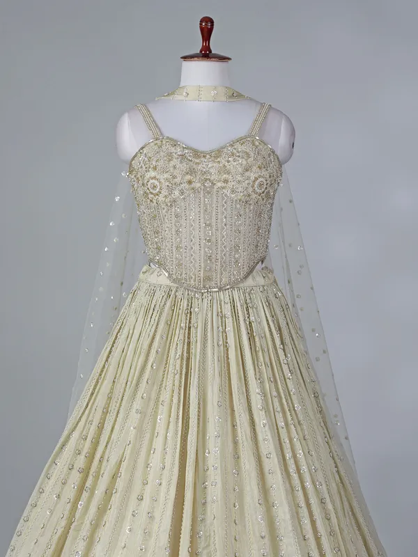 Cream silk lehenga choli with beaded detailing