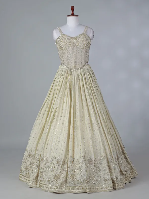 Cream silk lehenga choli with beaded detailing
