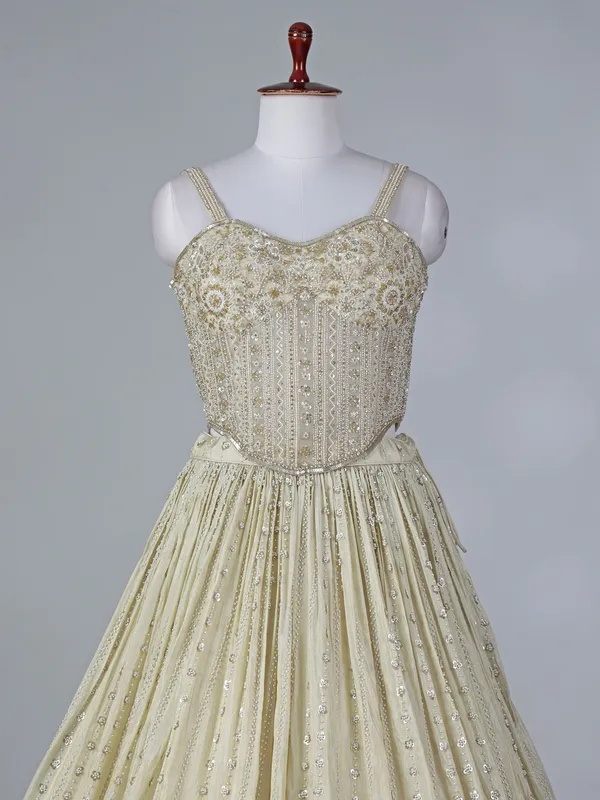 Cream silk lehenga choli with beaded detailing