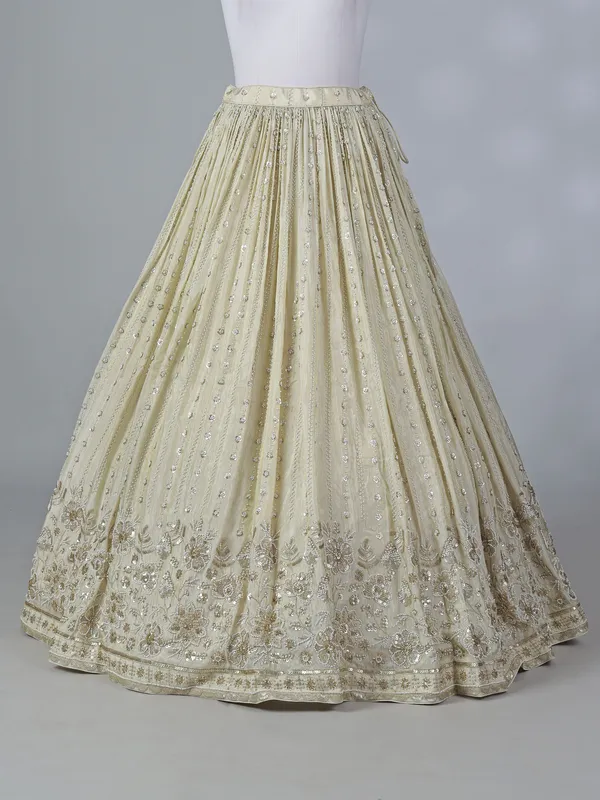 Cream silk lehenga choli with beaded detailing