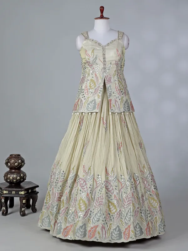 Cream silk lehenga choli with cowrie shells work