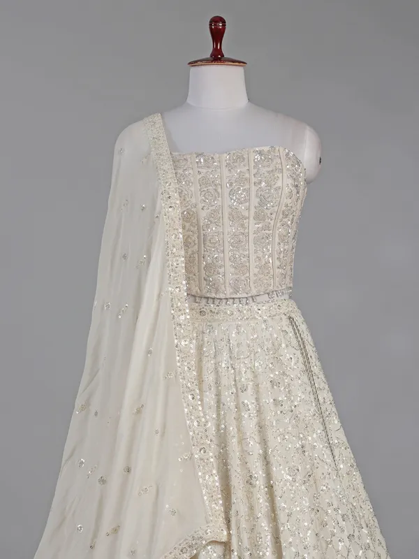 Cream silk lehenga choli with cutdana and sequins