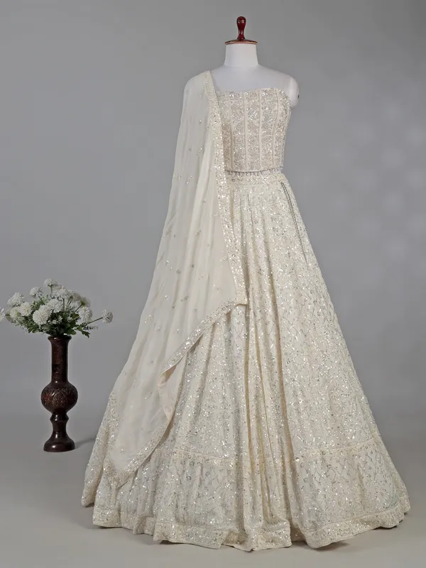 Cream silk lehenga choli with cutdana and sequins
