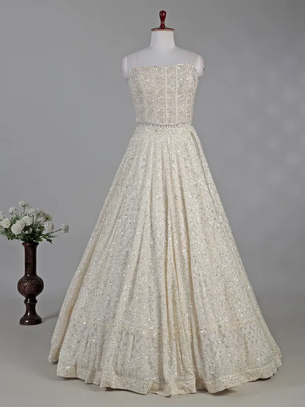 Cream silk lehenga choli with cutdana and sequins