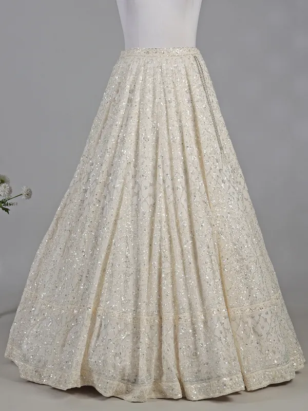Cream silk lehenga choli with cutdana and sequins