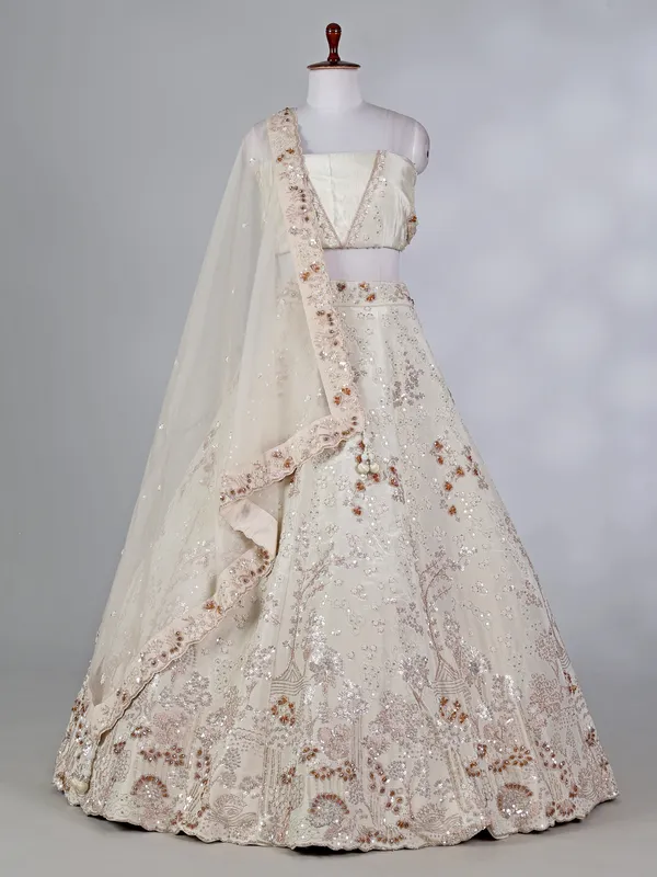 Cream silk lehenga choli with pearls and cutdana work
