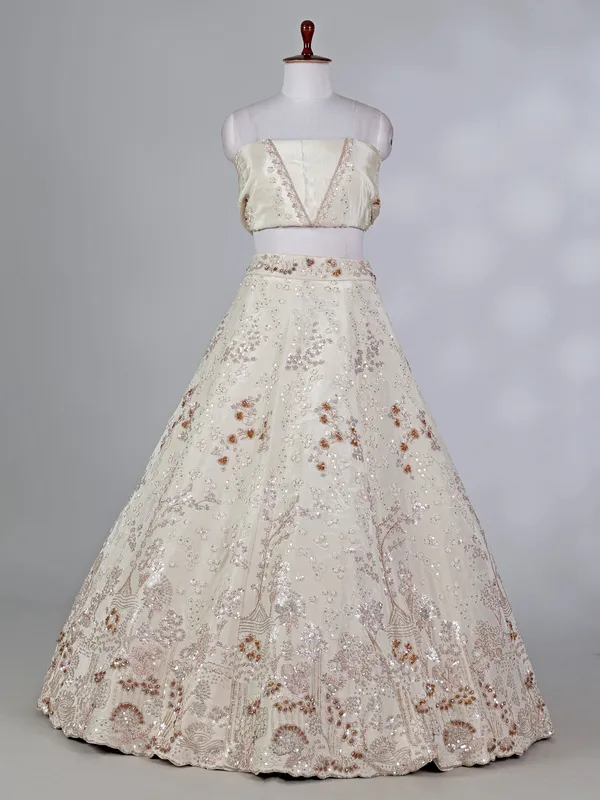 Cream silk lehenga choli with pearls and cutdana work