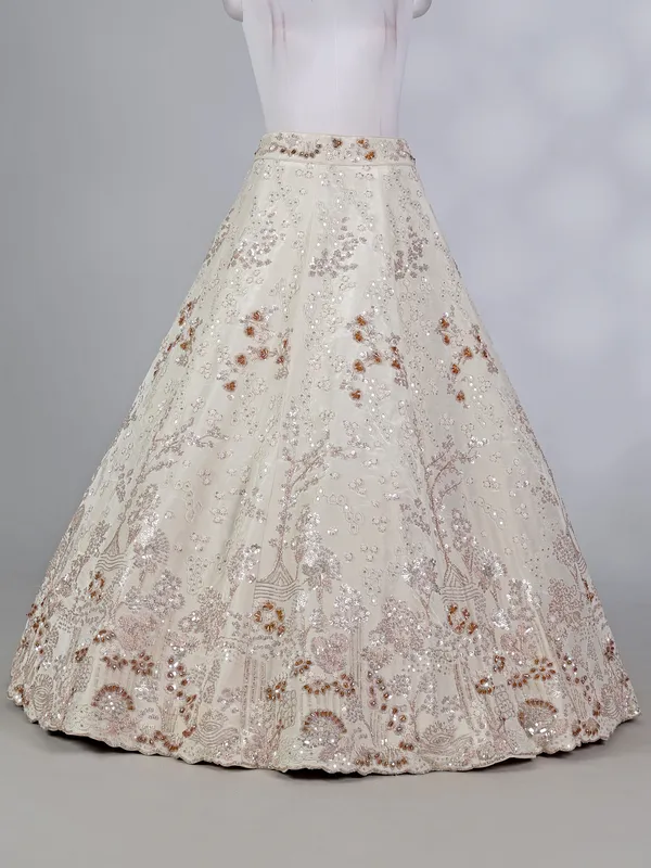 Cream silk lehenga choli with pearls and cutdana work