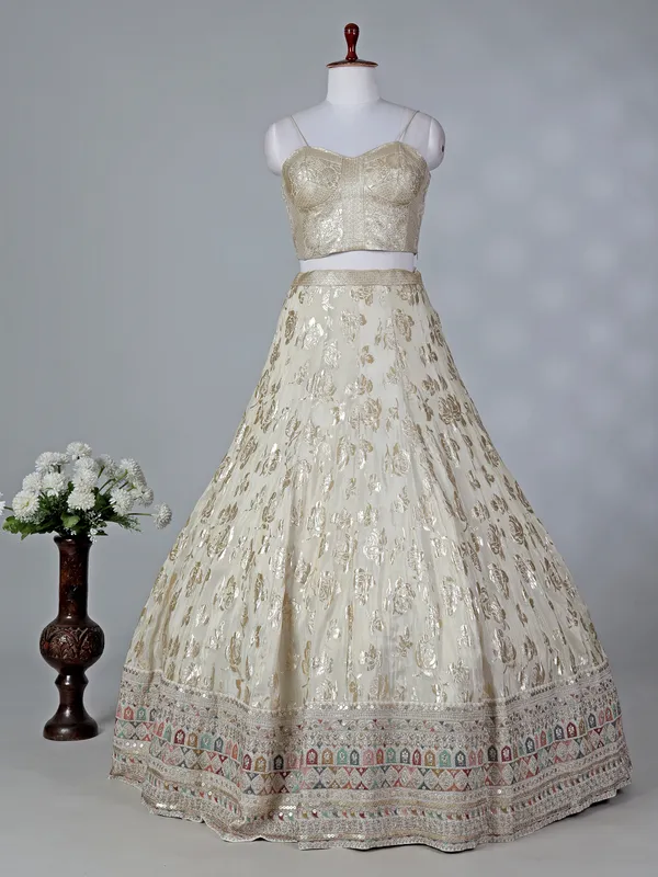 Cream silk lehenga choli with sleeveless choli