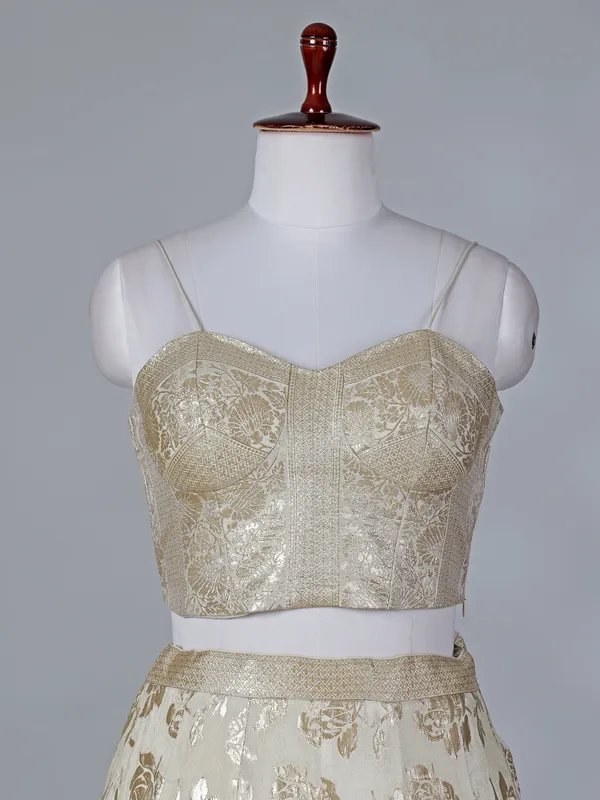 Cream silk lehenga choli with sleeveless choli
