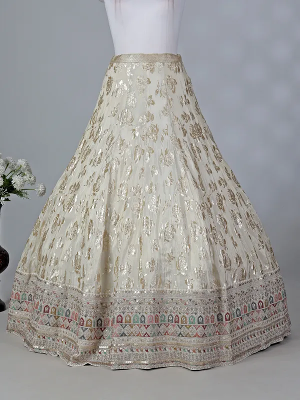 Cream silk lehenga choli with sleeveless choli