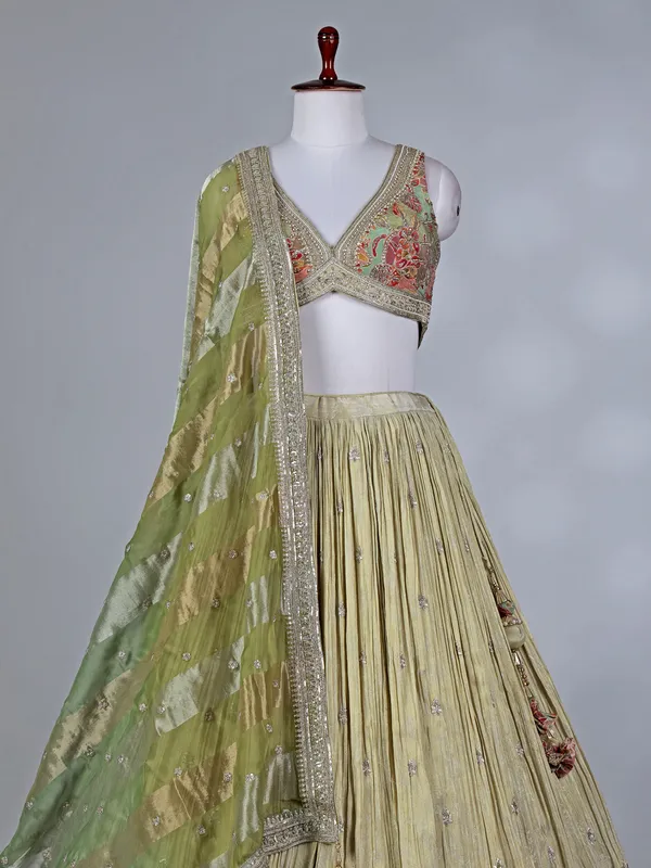 Cream silk lehenga choli with zardosi work