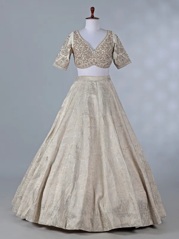 Cream silk lehenga with pearls and zari work