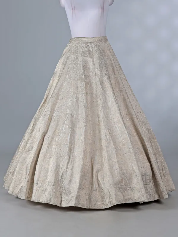 Cream silk lehenga with pearls and zari work