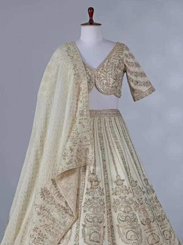 Cream silk lehenga with resham and sequins work