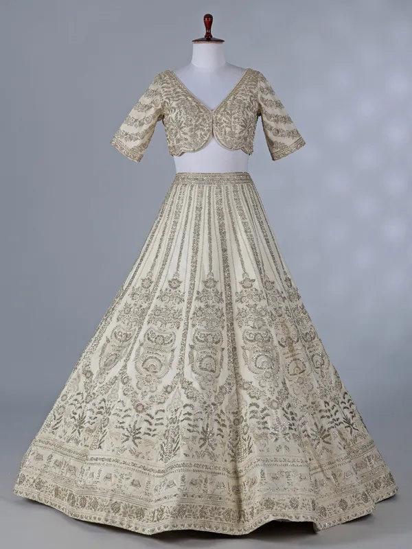 Cream silk lehenga with resham and sequins work