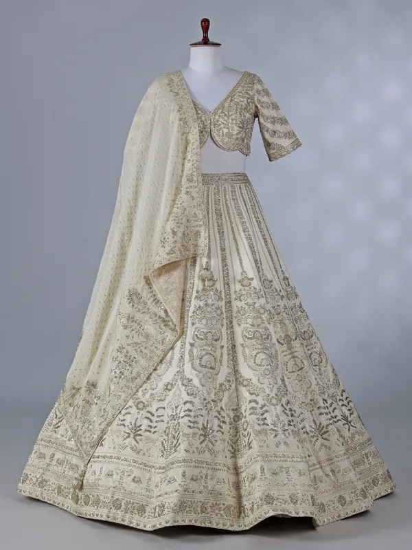 Cream silk lehenga with resham and sequins work