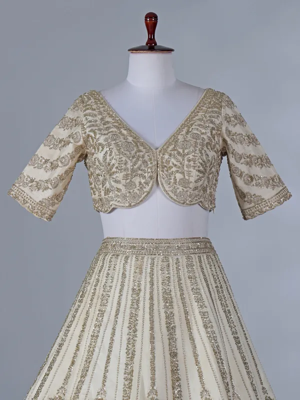 Cream silk lehenga with resham and sequins work