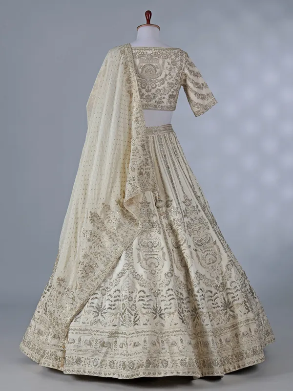 Cream silk lehenga with resham and sequins work