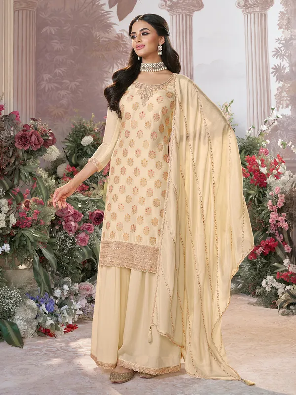 Cream silk pakistani palazzo suit with zari work