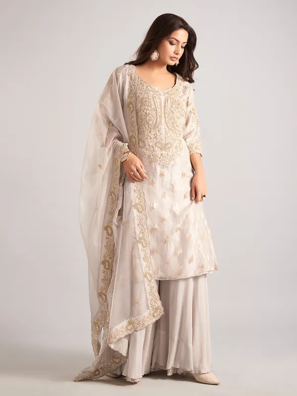Cream silk palazzo suit with zardosi and cutdana work