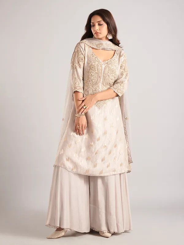 Cream silk palazzo suit with zardosi and cutdana work
