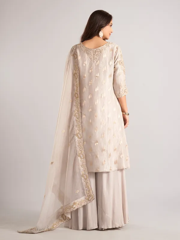 Cream silk palazzo suit with zardosi and cutdana work