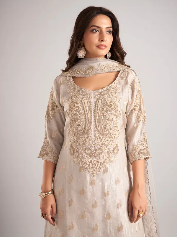 Cream silk palazzo suit with zardosi and cutdana work