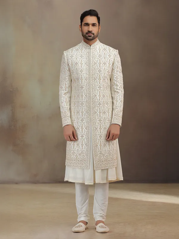 Cream silk peshwai groom sherwani with dupatta