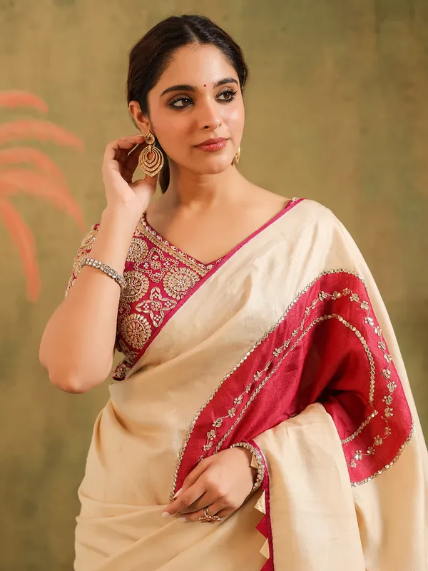 Cream silk printed saree with bold blouse