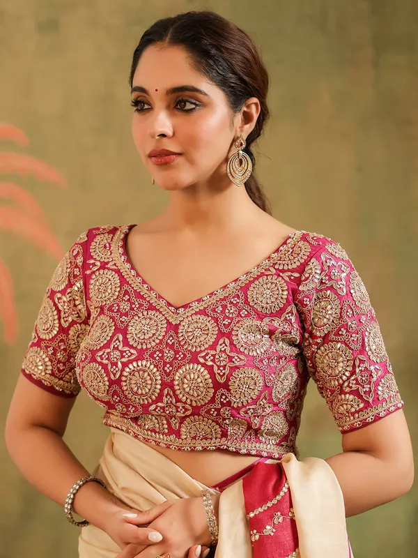 Cream silk printed saree with bold blouse