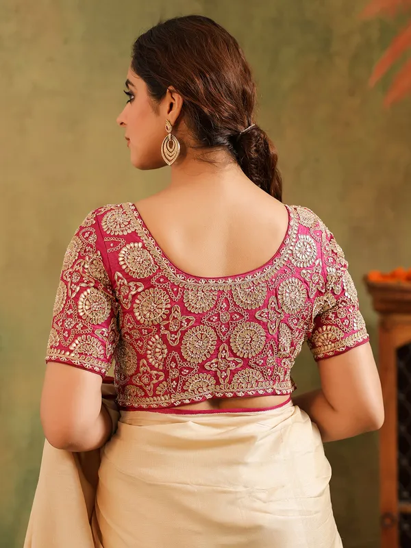 Cream silk printed saree with bold blouse