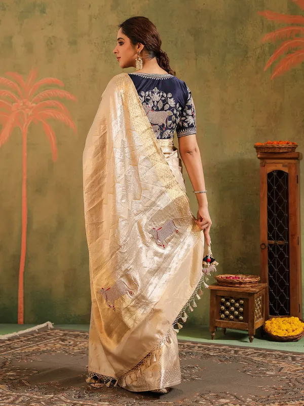 Cream silk saree designed for wedding