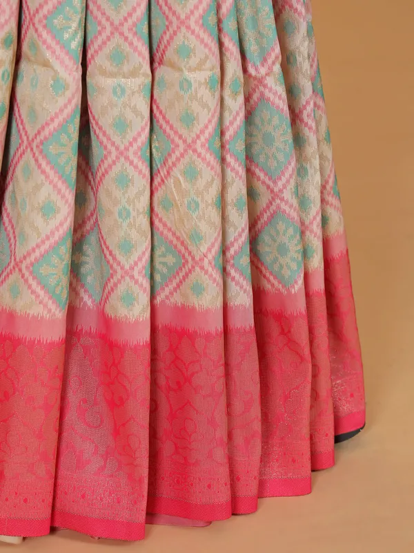 Cream silk saree with bold pallu