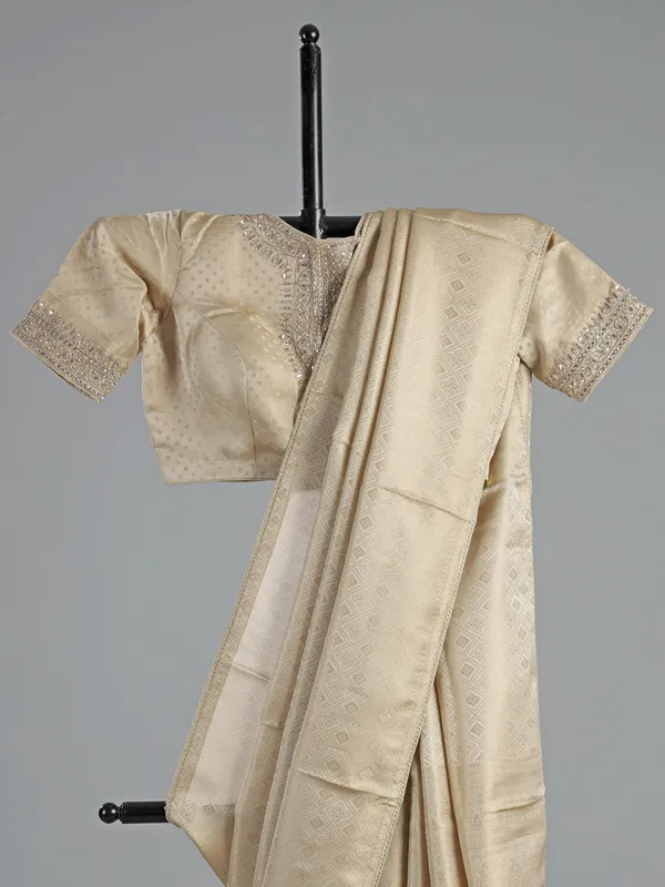 Cream silk saree with zardosi detailing