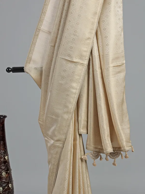Cream silk saree with zardosi detailing