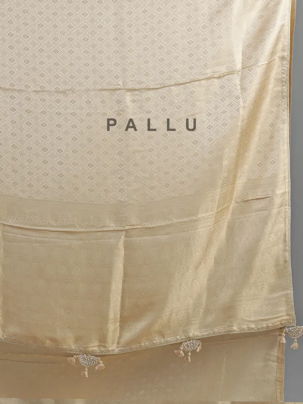 Cream silk saree with zardosi detailing