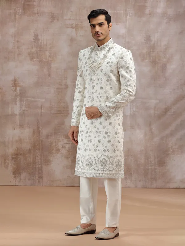 Cream silk sherwani enhanced with thread embroidery