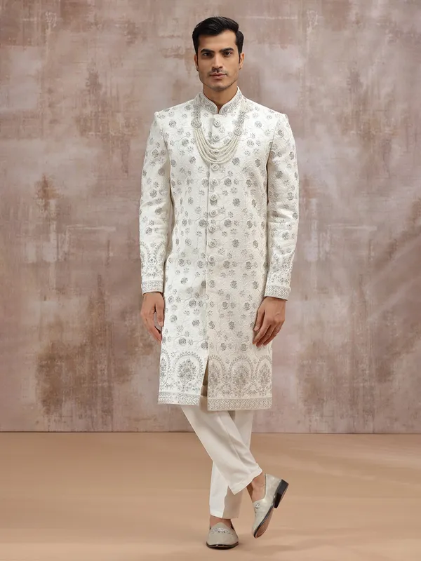Cream silk sherwani enhanced with thread embroidery
