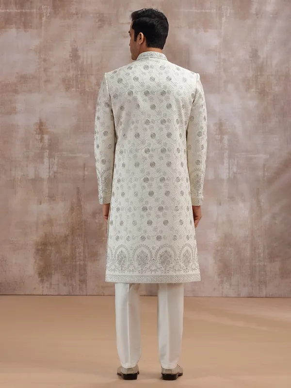 Cream silk sherwani enhanced with thread embroidery
