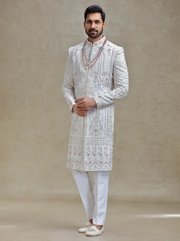 Cream silk sherwani in rich embellishment