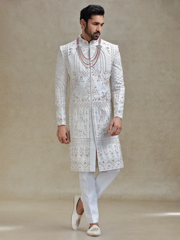 Cream silk sherwani in rich embellishment