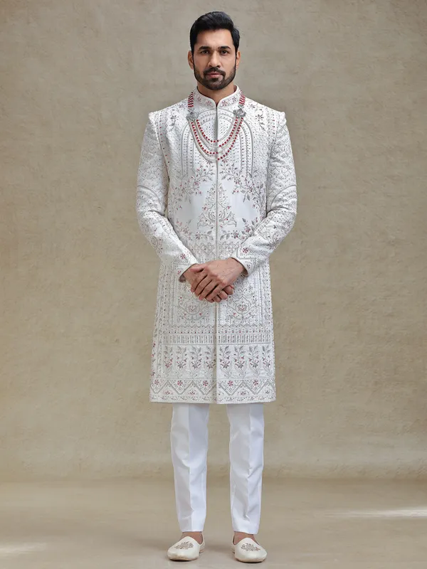 Cream silk sherwani in rich embellishment