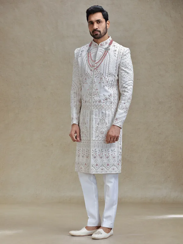 Cream silk sherwani in rich embellishment