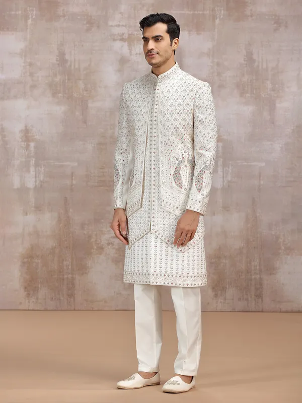Cream silk sherwani with elegant resham detailing