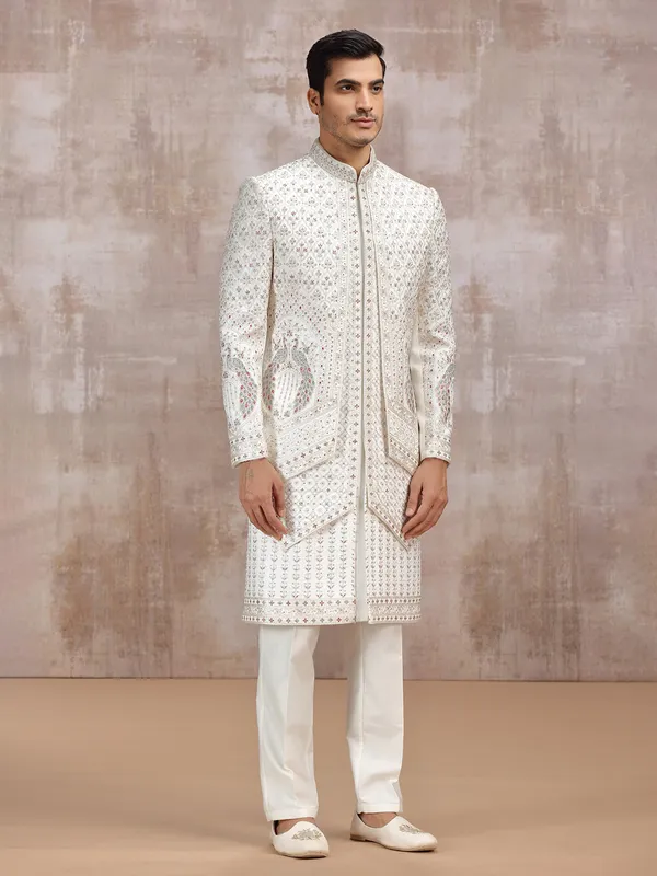 Cream silk sherwani with elegant resham detailing