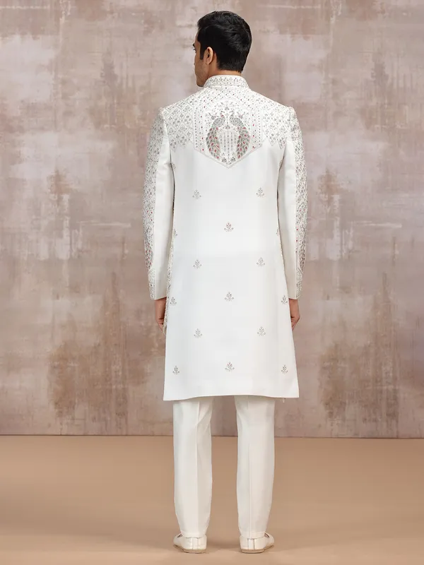 Cream silk sherwani with elegant resham detailing