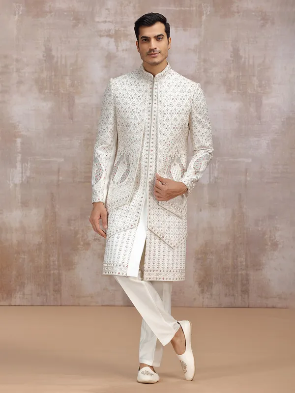 Cream silk sherwani with elegant resham detailing